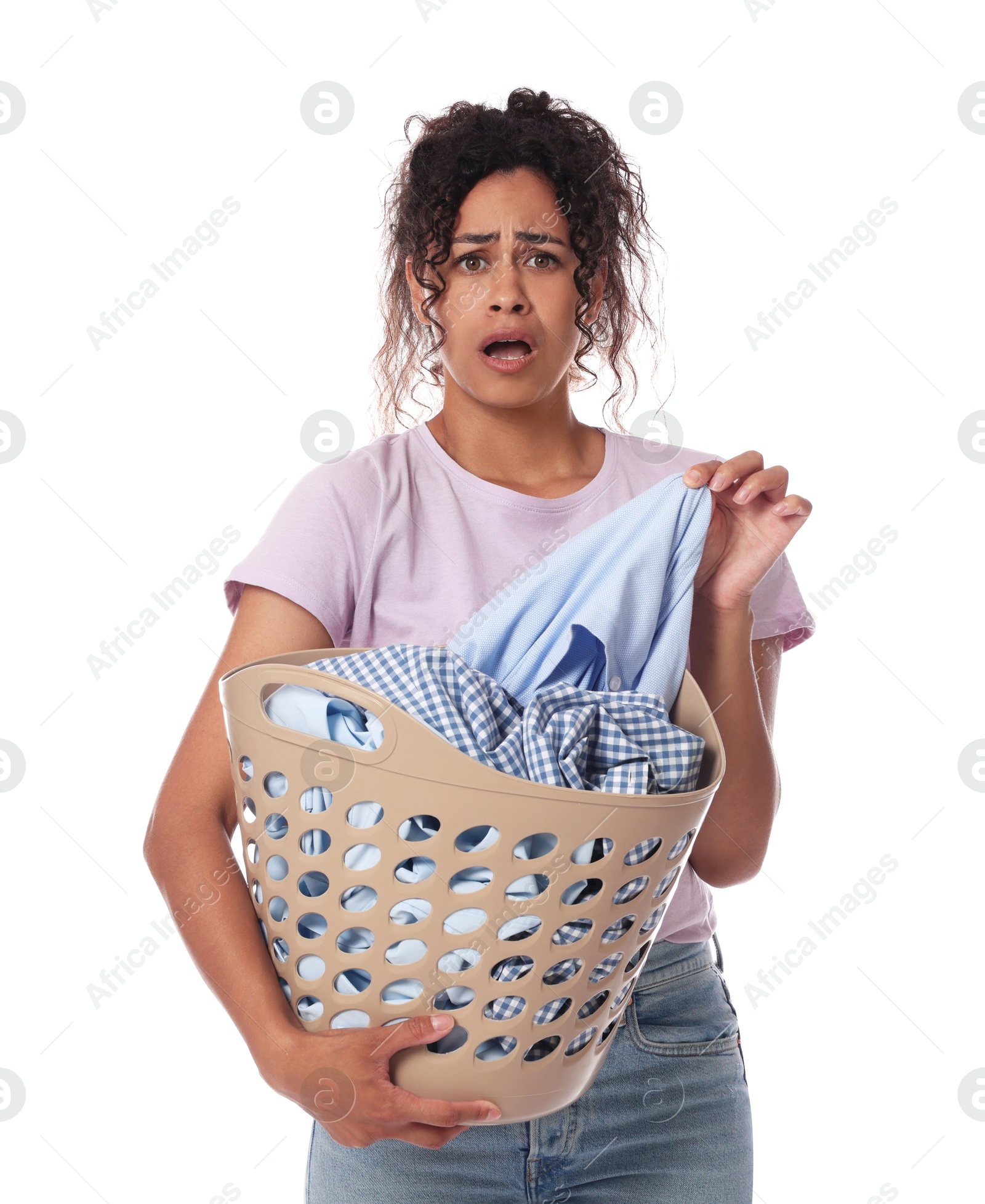 Photo of Emotional woman with basket full of laundry on white background