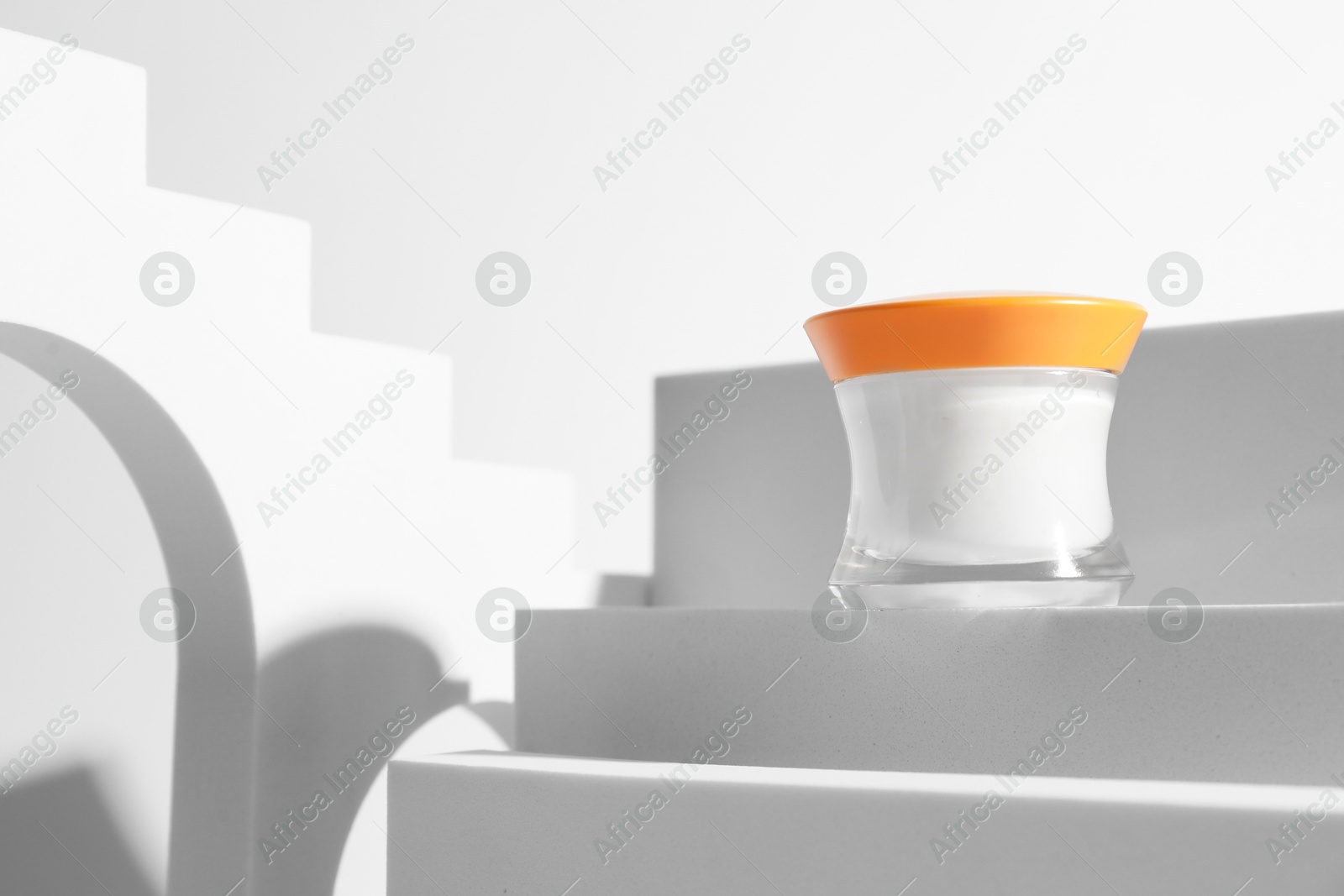 Photo of Stylish presentation of facial cream on white background