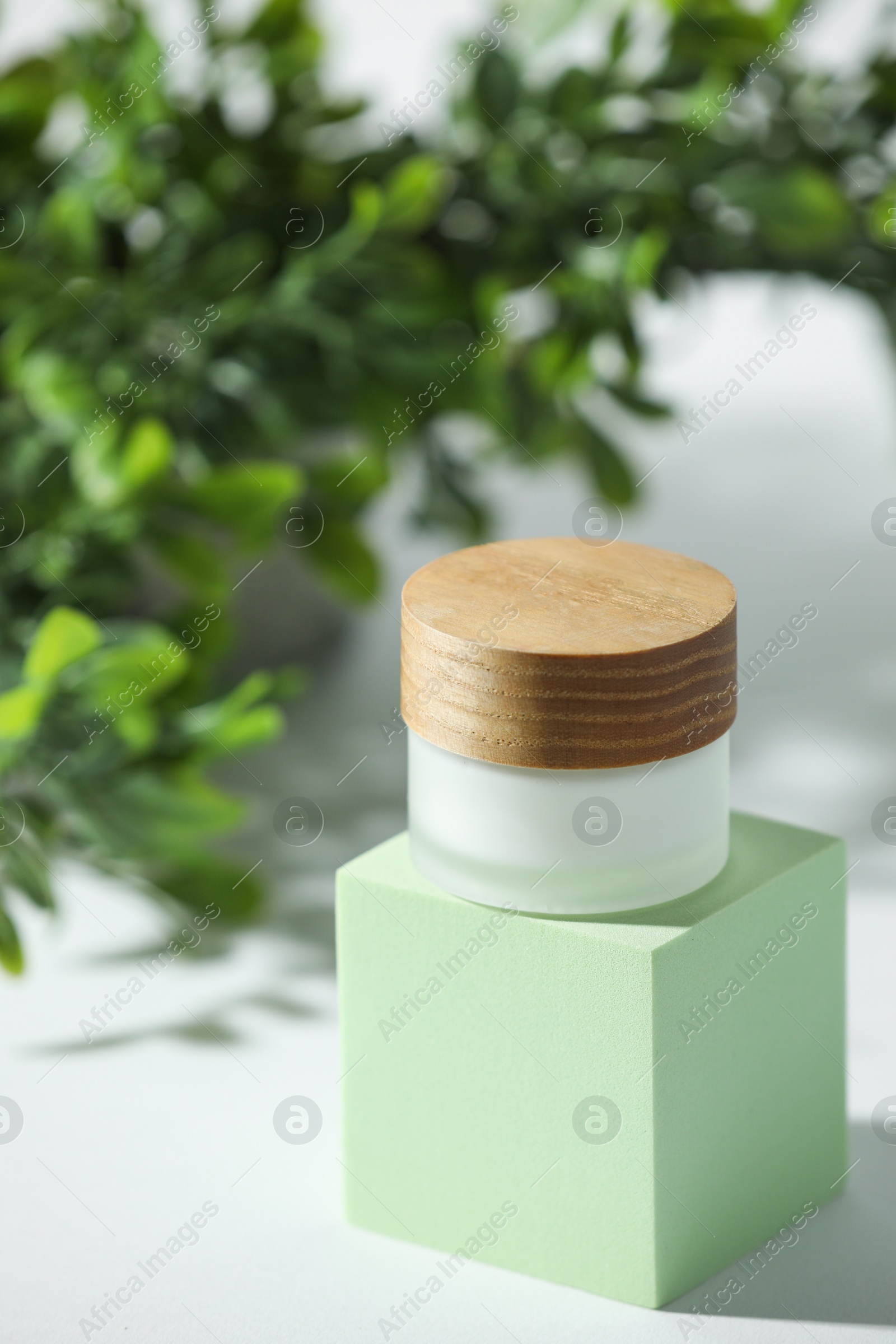 Photo of Stylish presentation of facial cream on white table