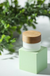 Photo of Stylish presentation of facial cream on white table