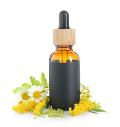 Photo of Bottle of tincture and flowers isolated on white