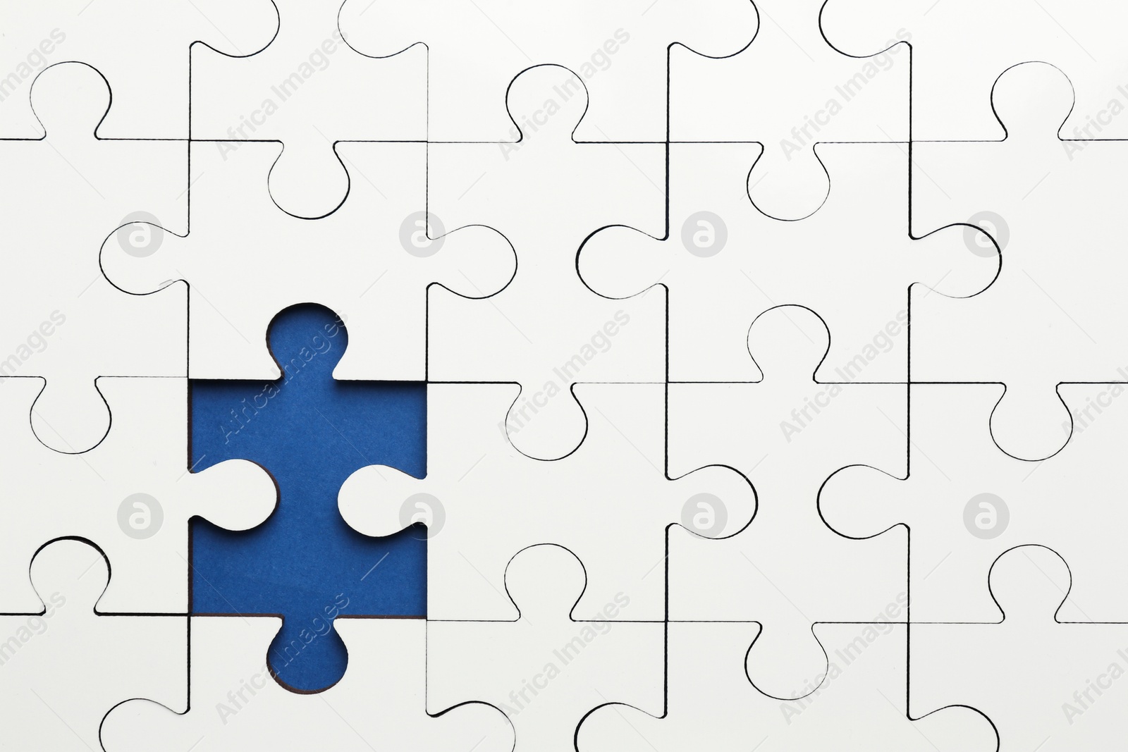 Photo of White puzzle with missing piece on blue background, top view