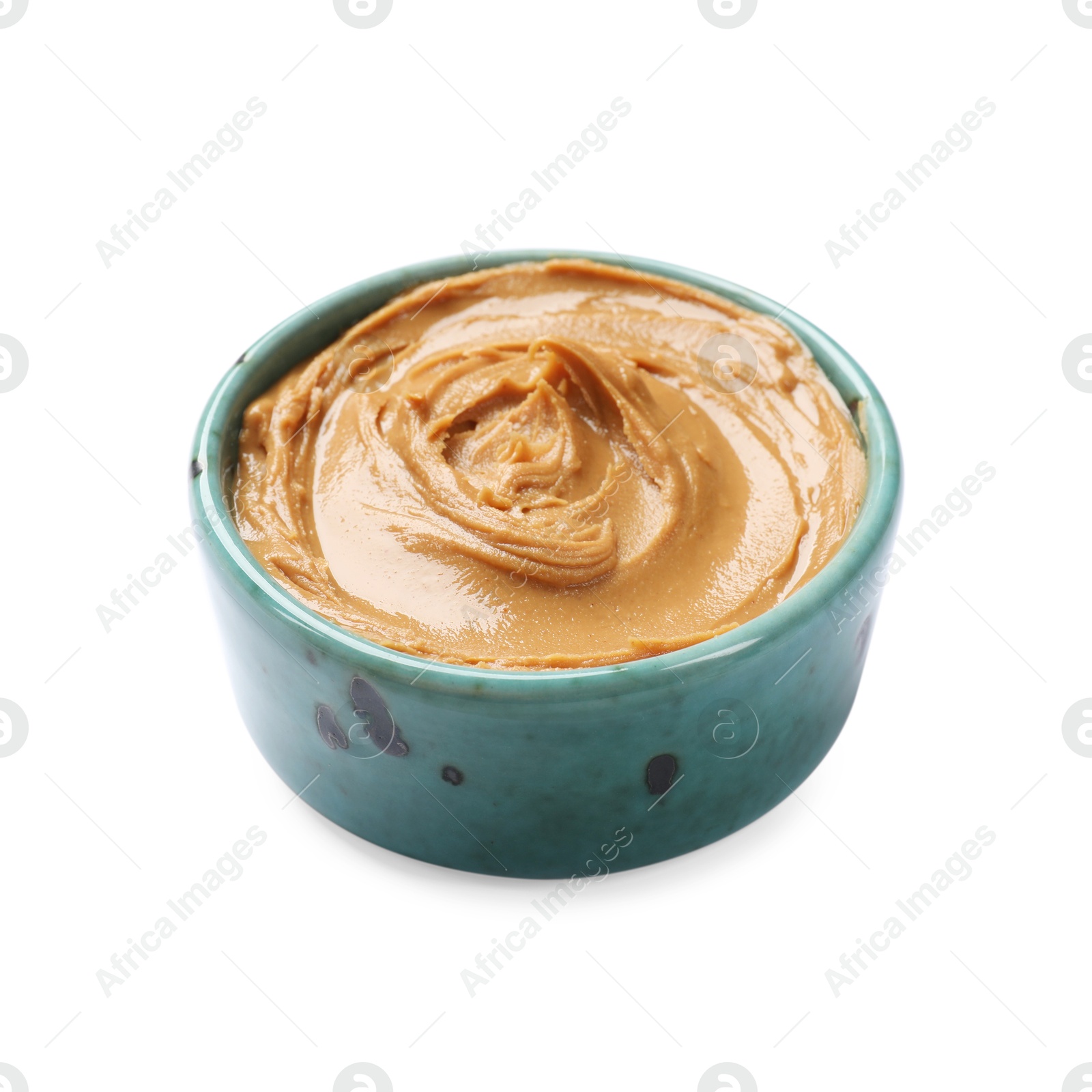 Photo of Tasty peanut butter in bowl isolated on white