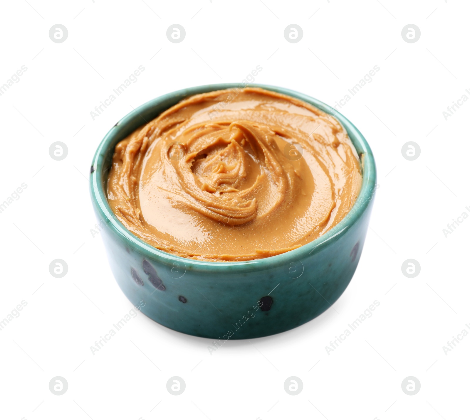 Photo of Tasty peanut butter in bowl isolated on white