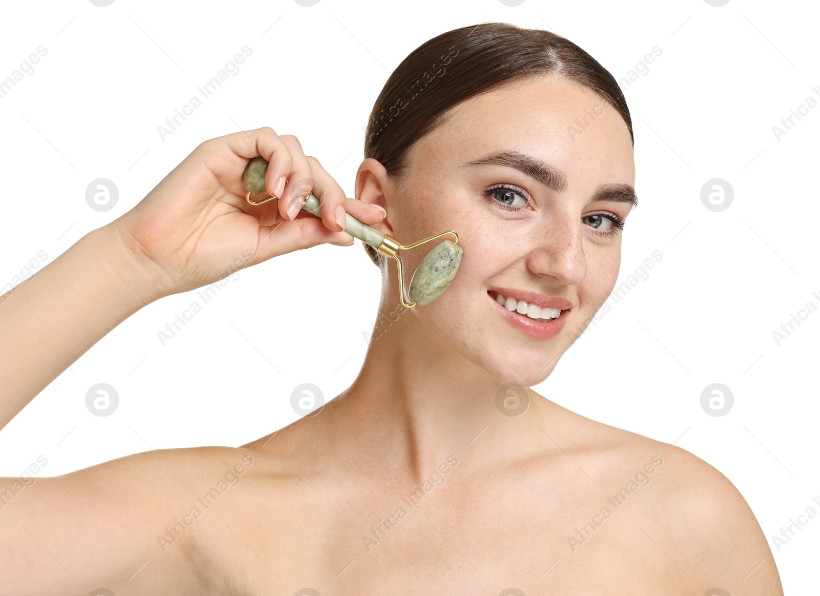 Photo of Beautiful young woman doing facial massage with roller on white background