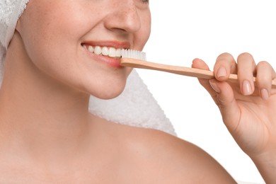 Photo of Woman brushing her teeth on white background, closeup