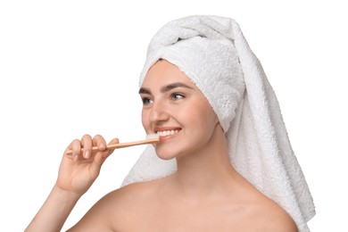 Beautiful woman brushing her teeth on white background