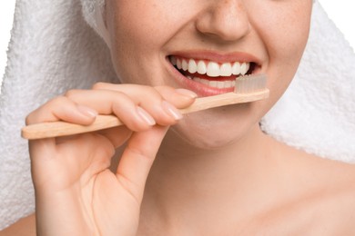 Photo of Woman brushing her teeth on white background, closeup