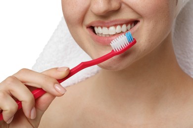 Woman brushing her teeth on white background, closeup