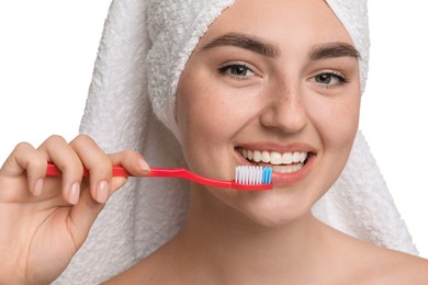 Beautiful woman brushing her teeth on white background