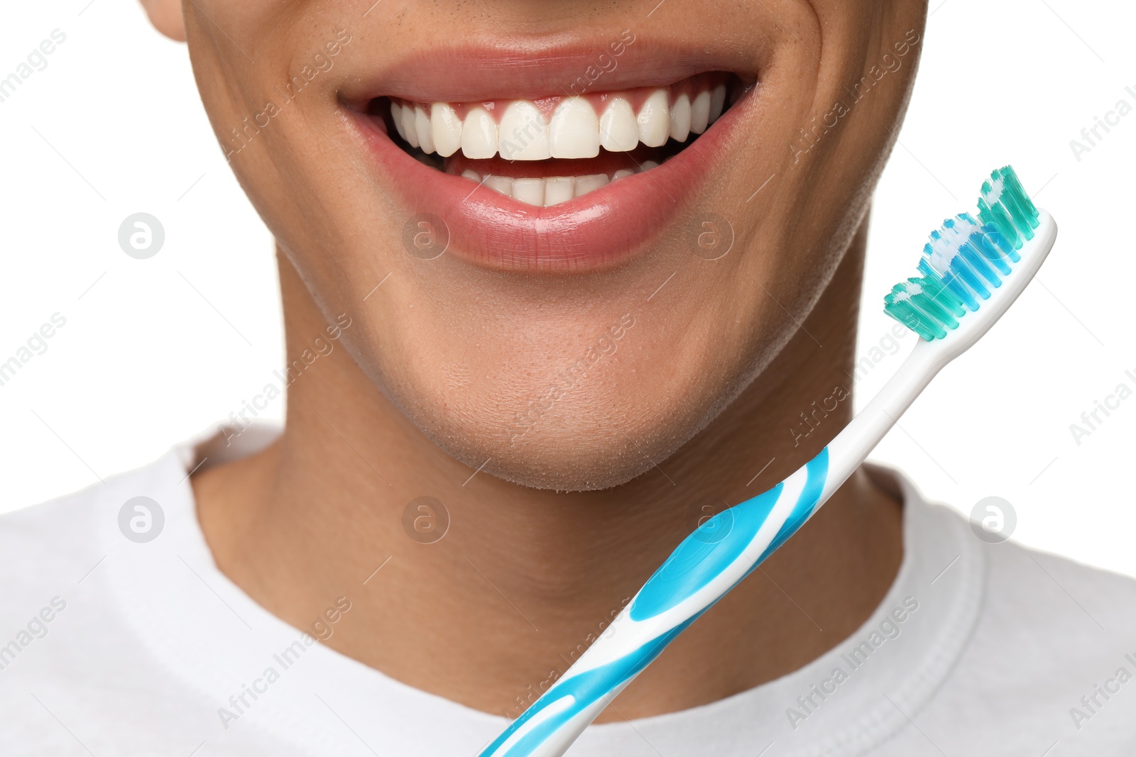 Photo of Young man with toothbrush on white background, closeup