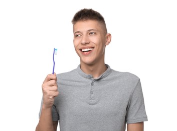 Photo of Happy young man with toothbrush on white background