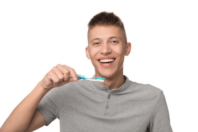 Photo of Young man brushing his teeth on white background