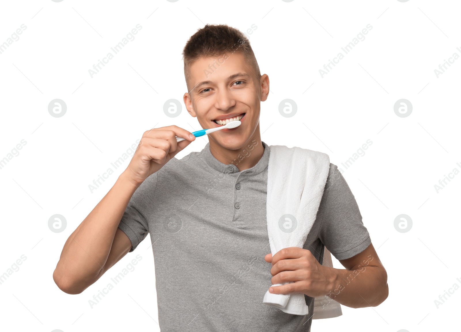 Photo of Young man brushing his teeth on white background