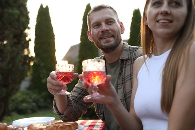 Photo of Couple having romantic date at table in garden