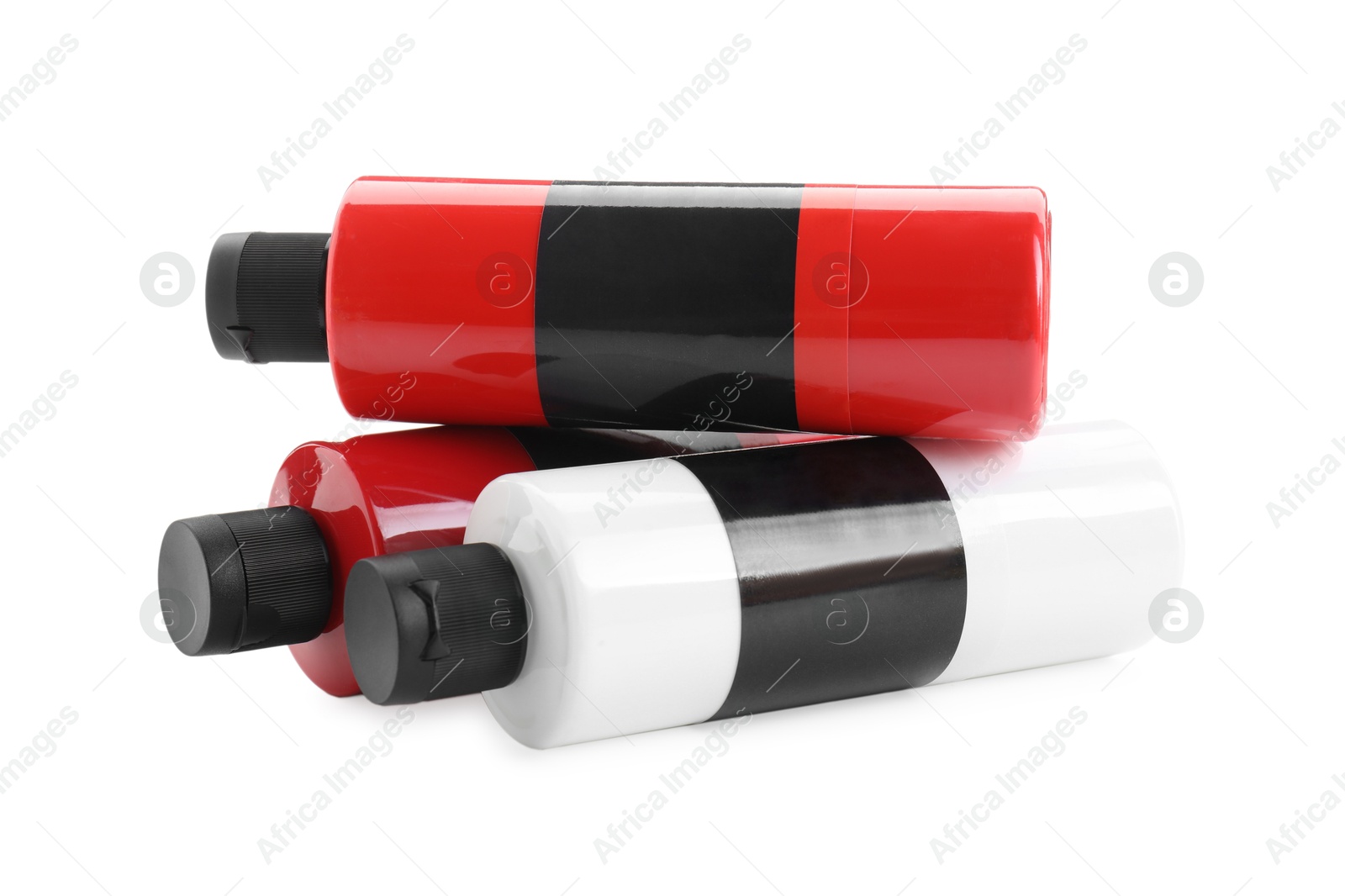 Photo of Acrylic paints of different colors in bottles isolated on white