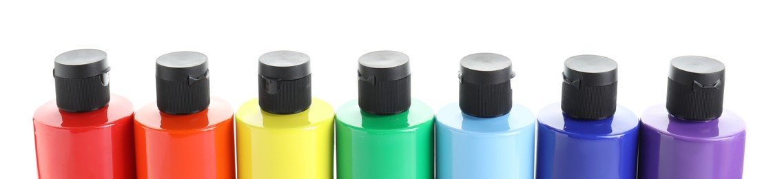 Photo of Acrylic paints of different colors in bottles isolated on white