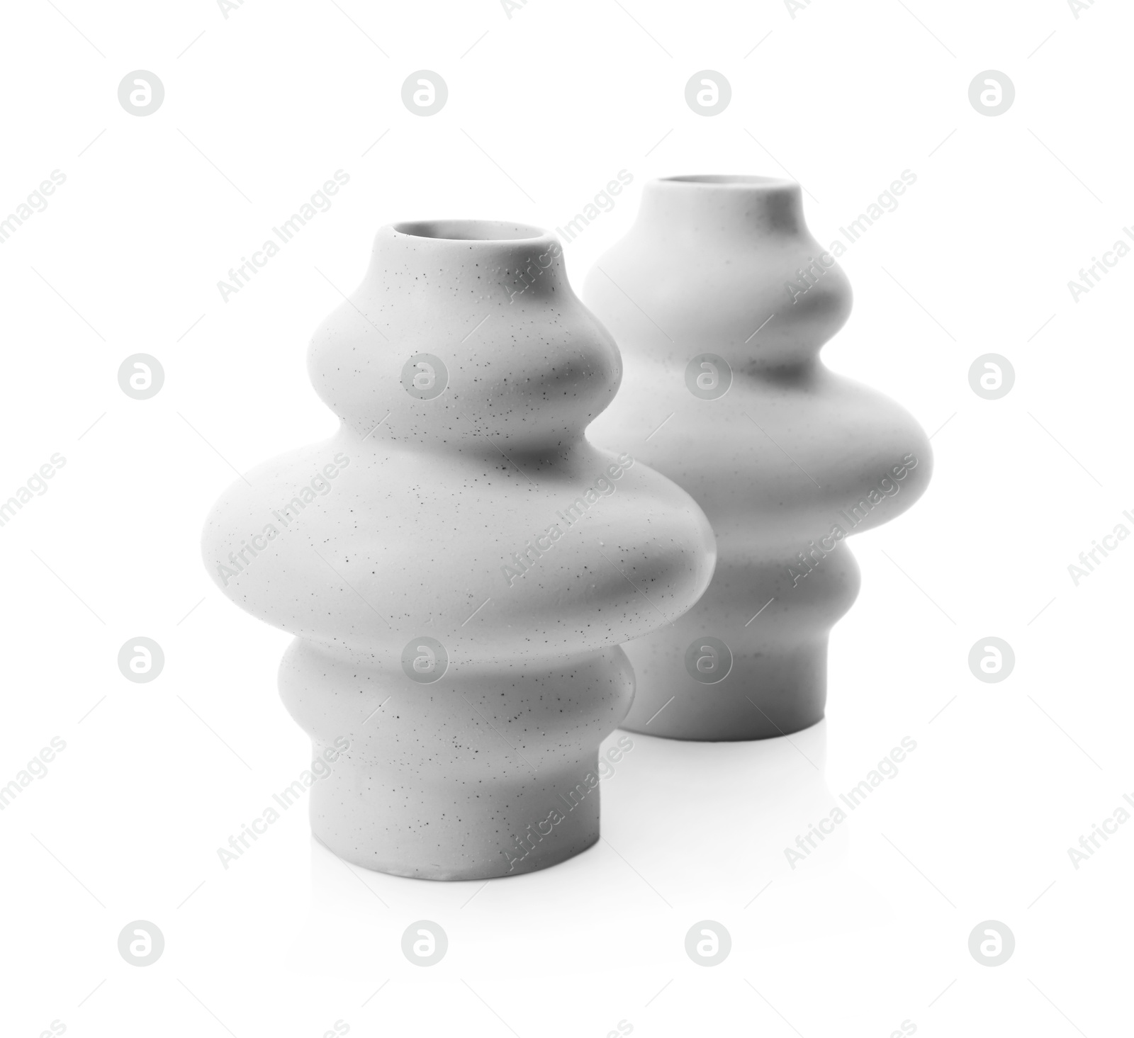 Photo of Two beautiful ceramic vases isolated on white