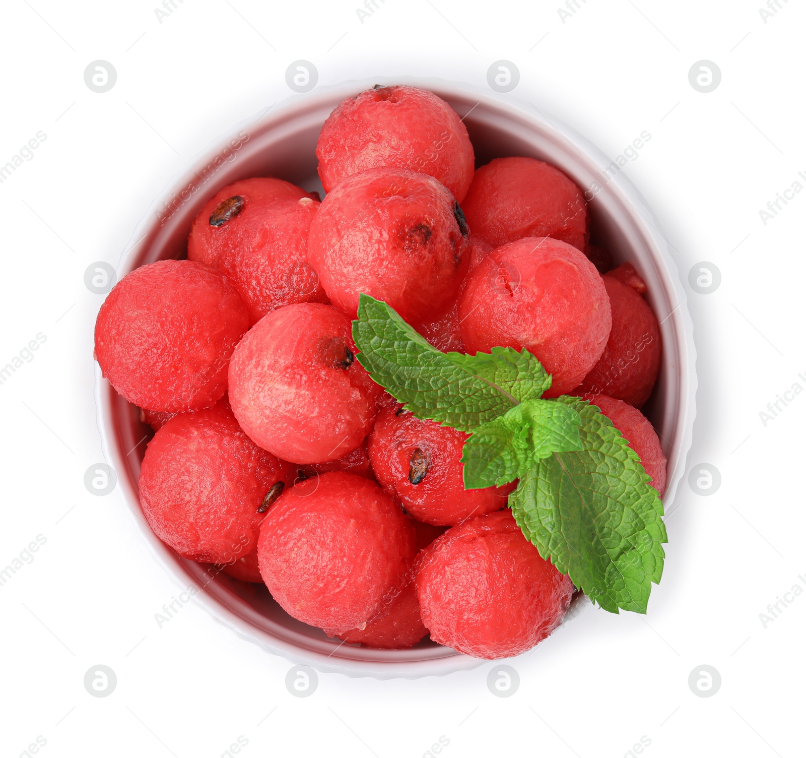 Photo of Tasty watermelon balls and mint in bowl isolated on white, top view