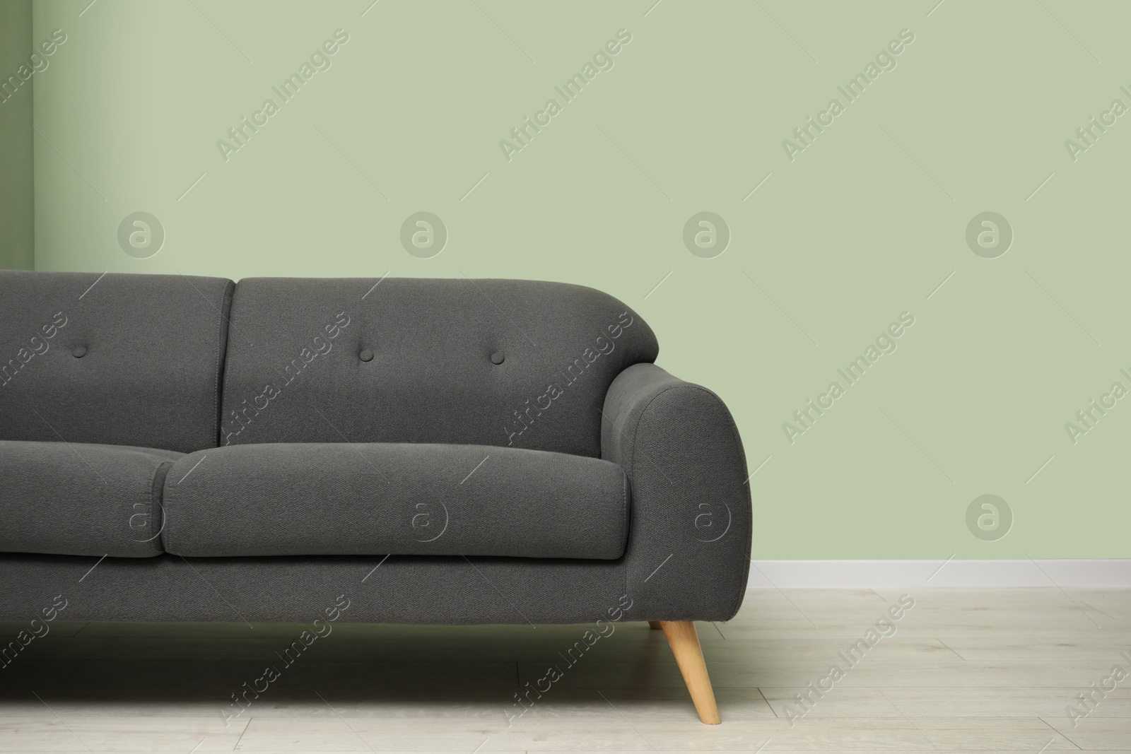 Photo of Stylish sofa in living room. Interior design