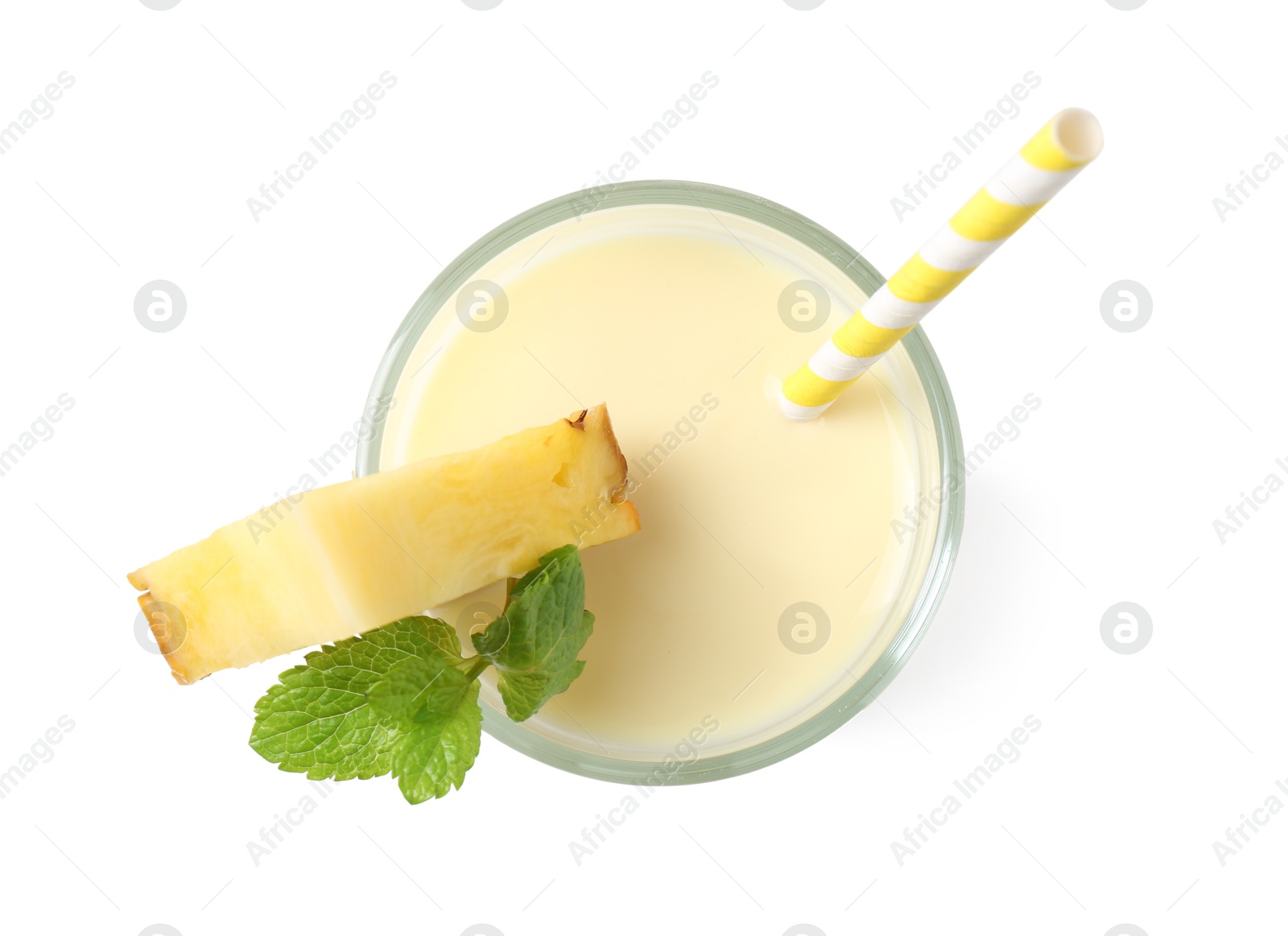 Photo of Tasty pineapple smoothie with slice of fresh fruit and mint in glass isolated on white, top view