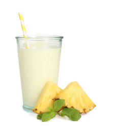 Photo of Tasty pineapple smoothie in glass, slices of fresh fruit and mint isolated on white