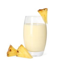 Photo of Tasty pineapple smoothie in glass and slices of fresh fruit isolated on white