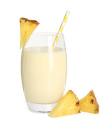 Photo of Tasty pineapple smoothie in glass and slices of fresh fruit isolated on white