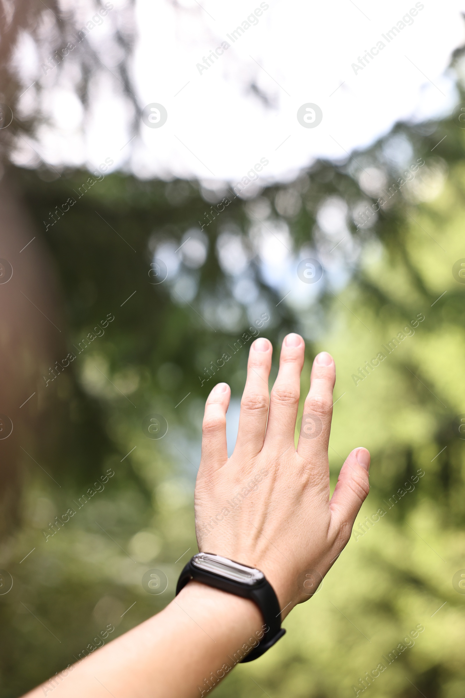 Photo of Young hiker with wristwatch, closeup. Space for text