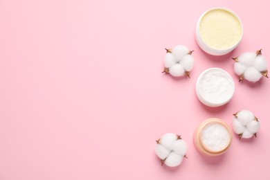 Photo of Different cosmetic products and cotton flowers on pink background, flat lay. Space for text