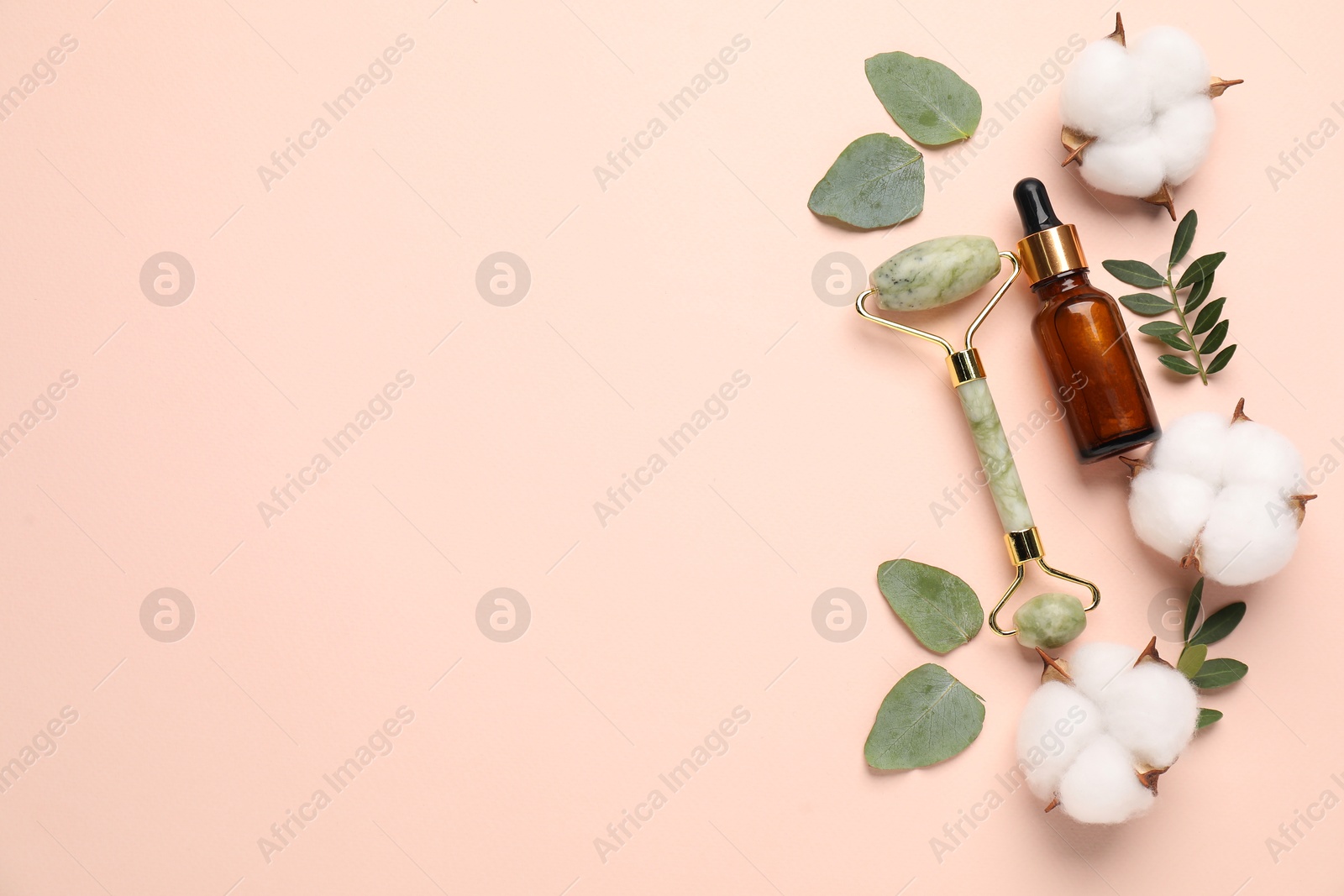 Photo of Different cosmetic products, cotton flowers and green leaves on beige background, flat lay. Space for text