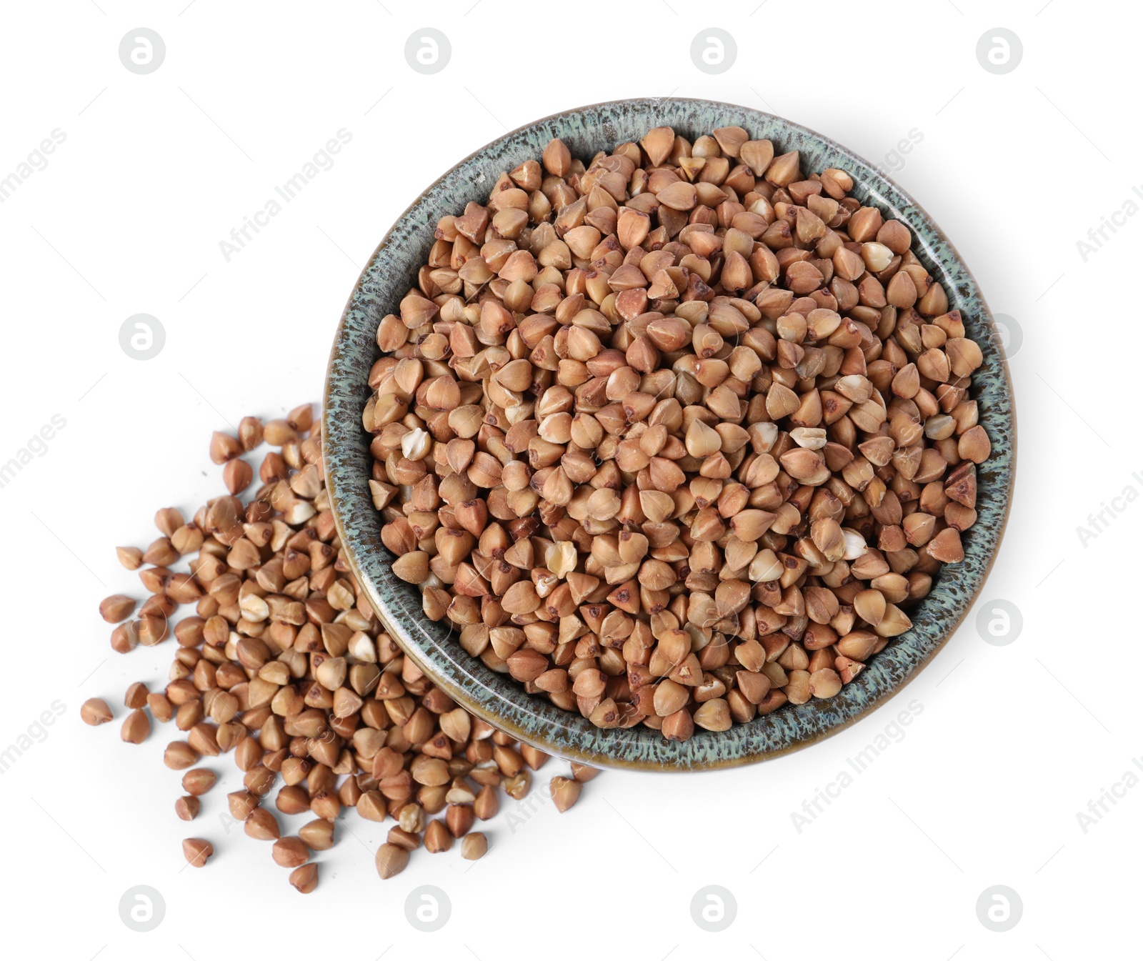 Photo of Raw buckwheat in bowl isolated on white, top view