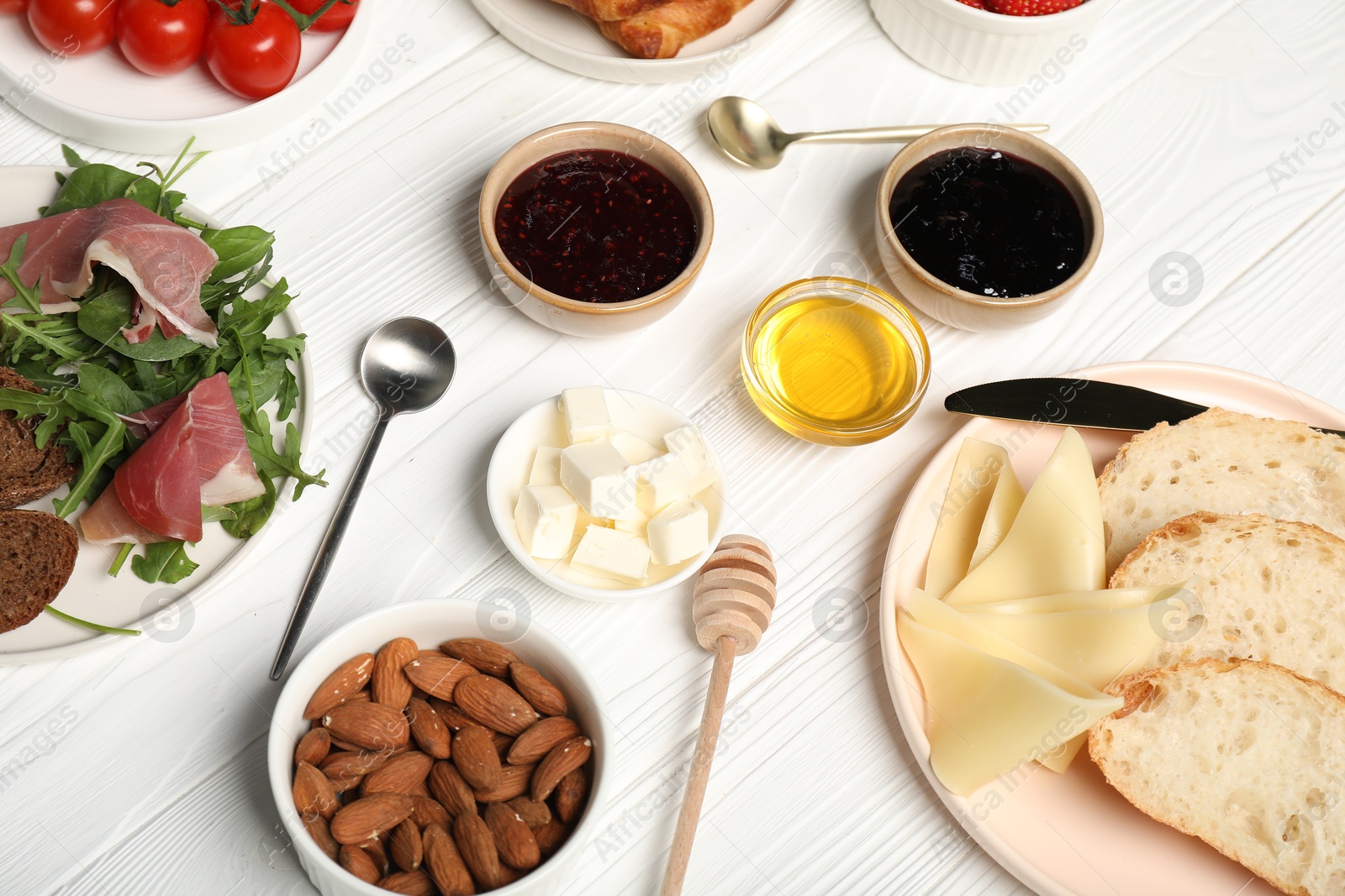 Photo of Different tasty food served for brunch on white wooden table