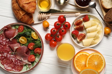 Photo of Different tasty food served for brunch on white wooden table, flat lay