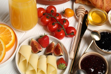 Photo of Different tasty food served for brunch on white wooden table, closeup