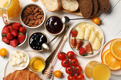 Photo of Different tasty food served for brunch on white wooden table, flat lay