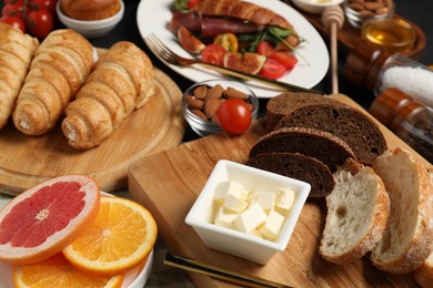 Photo of Different tasty food served for brunch on grey table, closeup