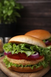 Photo of Delicious vegetarian burgers with chickpea cutlets on table, closeup