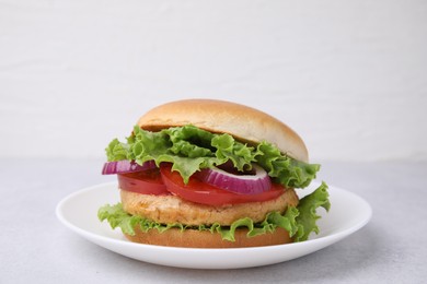 Photo of Delicious vegetarian burger with chickpea cutlet on light table, closeup