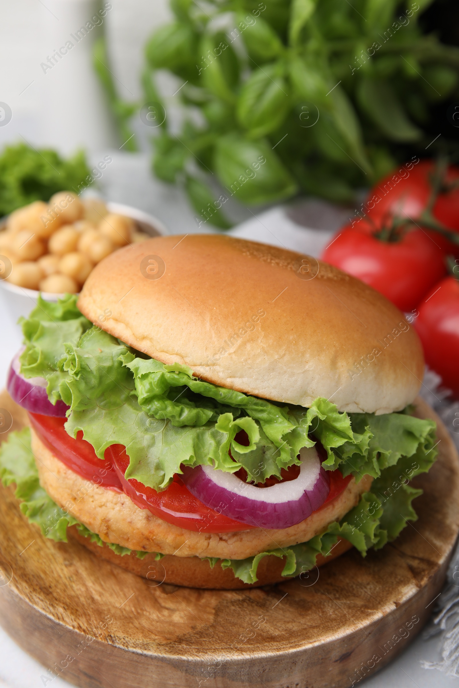 Photo of Delicious vegetarian burger with chickpea cutlet on table, closeup