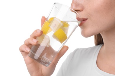 Photo of Woman drinking water with lemon on white background, closeup