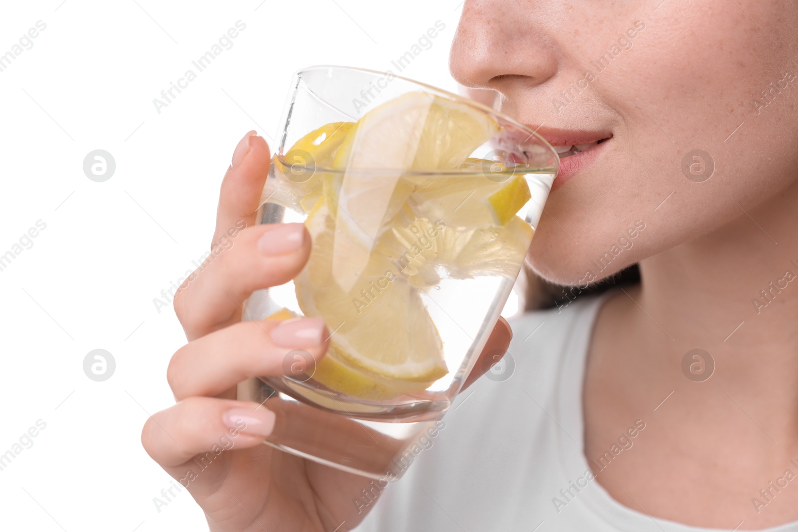 Photo of Woman drinking water with lemon on white background, closeup