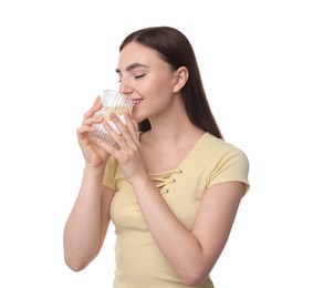 Woman drinking water with lemon on white background