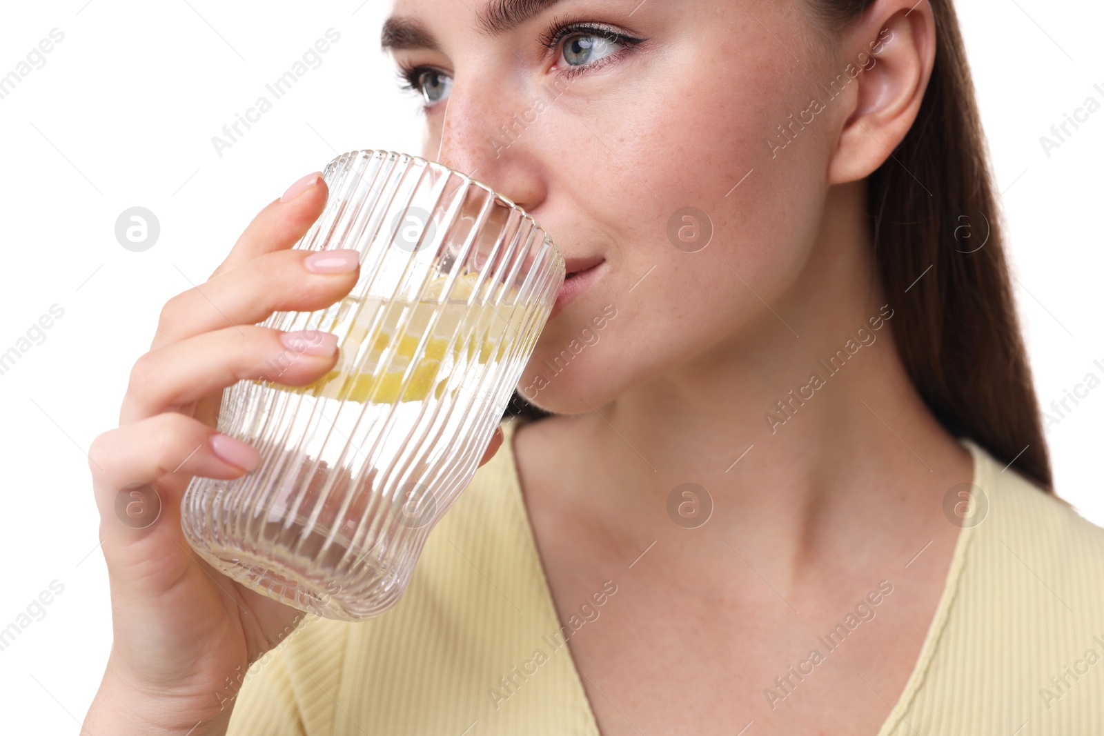 Photo of Woman drinking water with lemon on white background, closeup