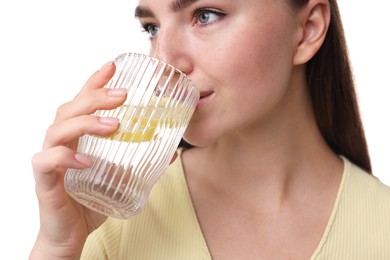 Photo of Woman drinking water with lemon on white background, closeup