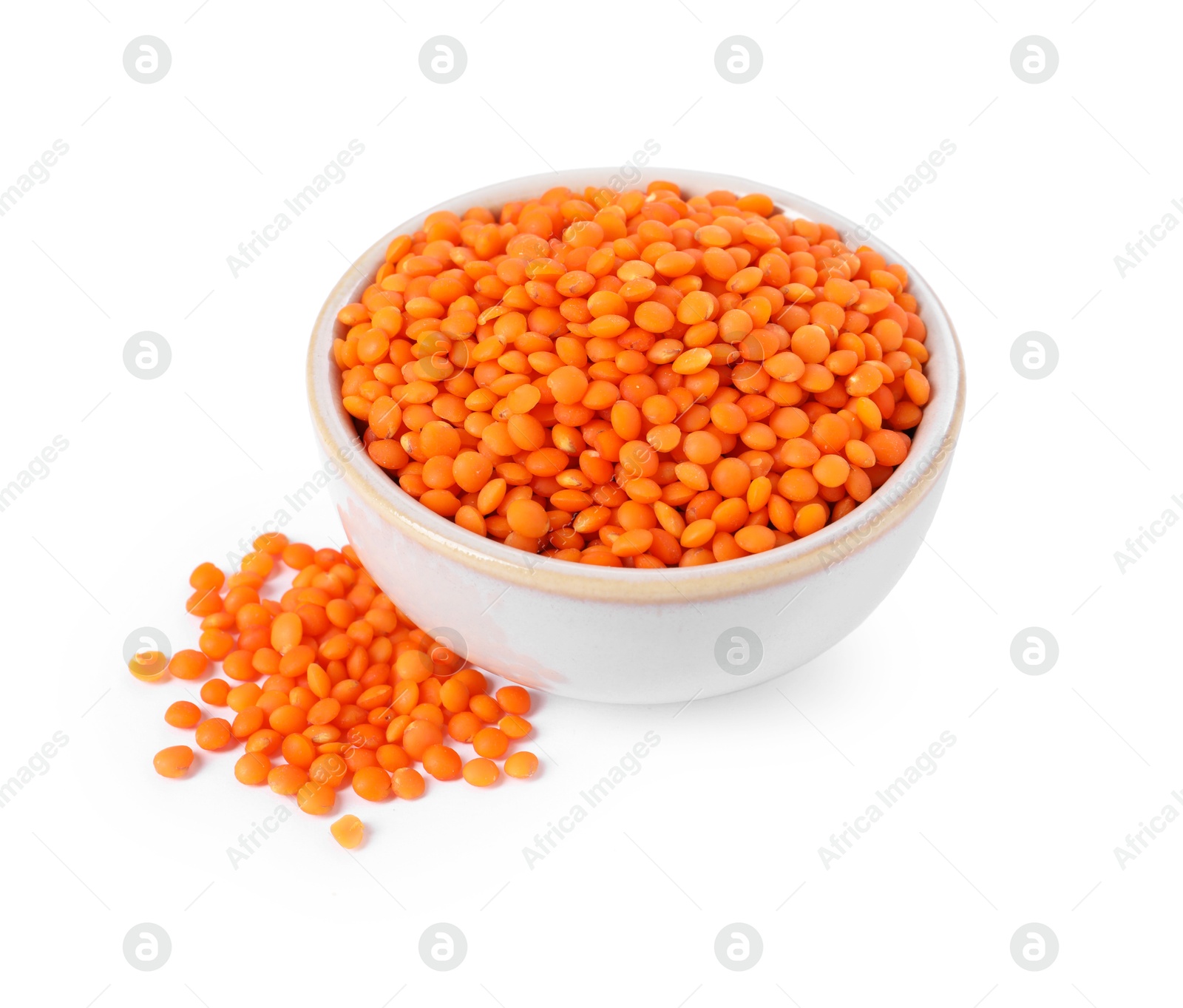 Photo of Raw lentils in bowl isolated on white