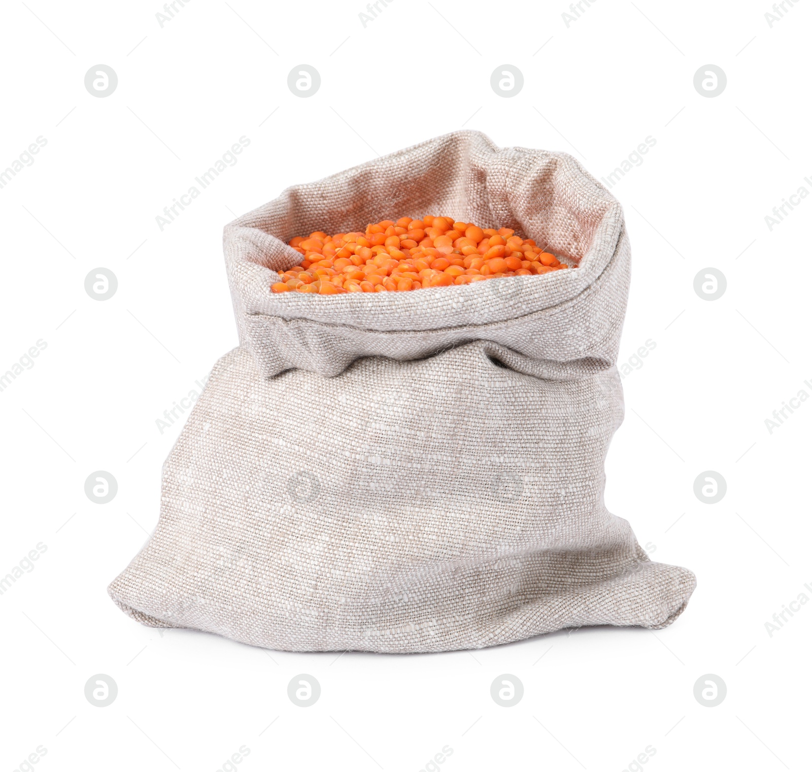 Photo of Raw lentils in burlap isolated on white