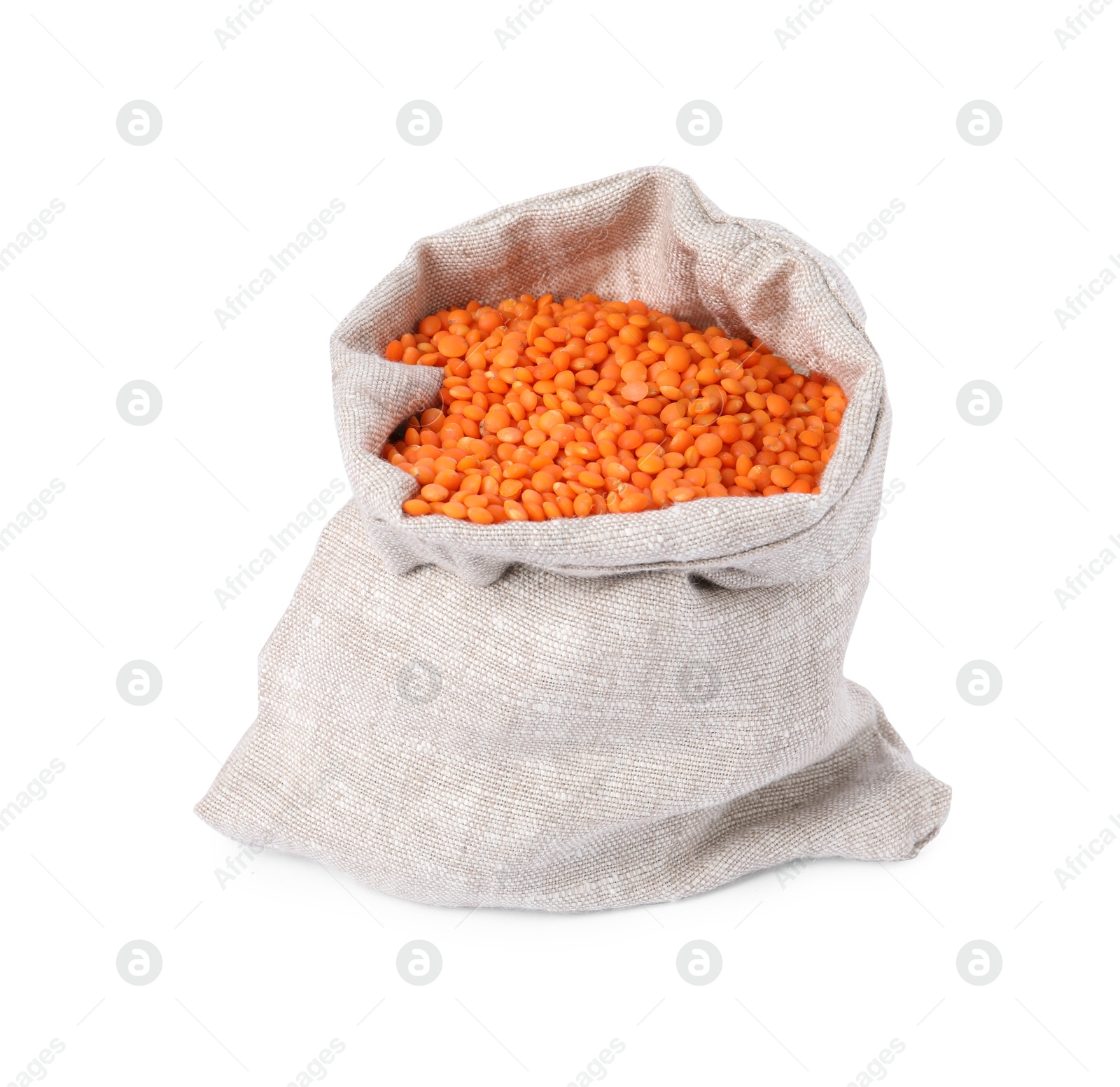 Photo of Raw lentils in burlap isolated on white