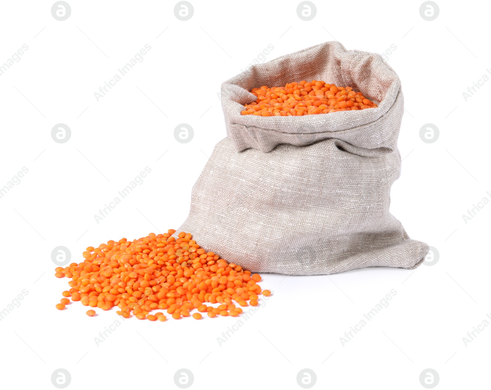 Photo of Raw lentils in burlap isolated on white