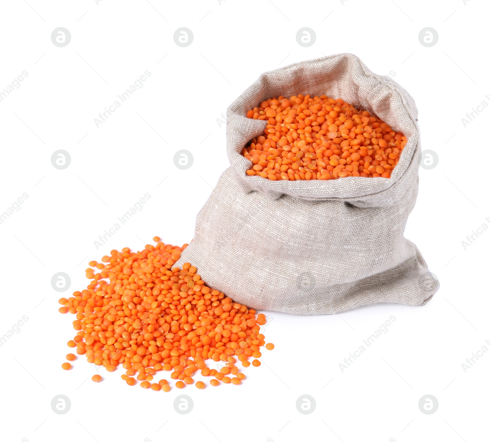 Photo of Raw lentils in burlap isolated on white